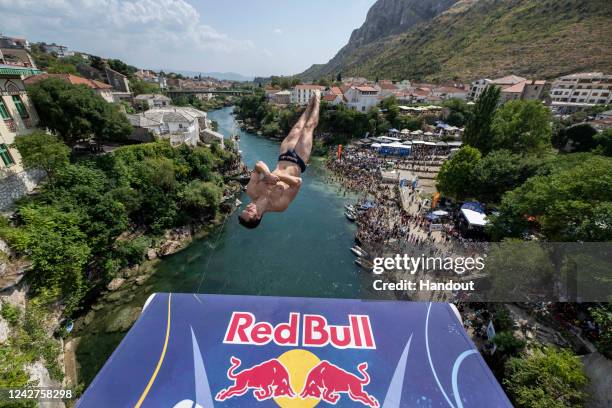 In this handout image provided by Red Bull, Aidan Heslop of the UK dives from the 27 metre platform on Stari Most during the final competition day of...