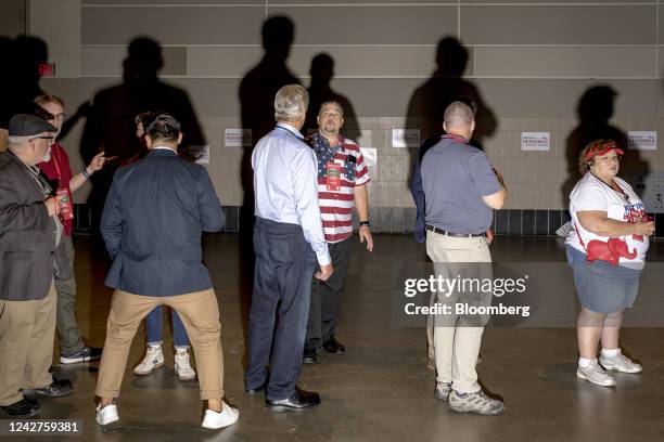 Attendees wait in line to vote during the MIGOP Nominating Convention in Lansing, Michigan, US, on Saturday, Aug. 27, 2022. Republican commentator...