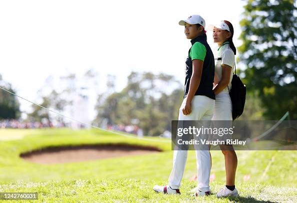 Lucy Lin Lucy Lin of Canada watches the golf with her mother and caddie Amanda ...