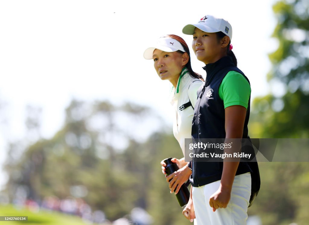 Lucy Lin Lucy Lin of Canada watches the golf with her mother and caddie Amanda ...