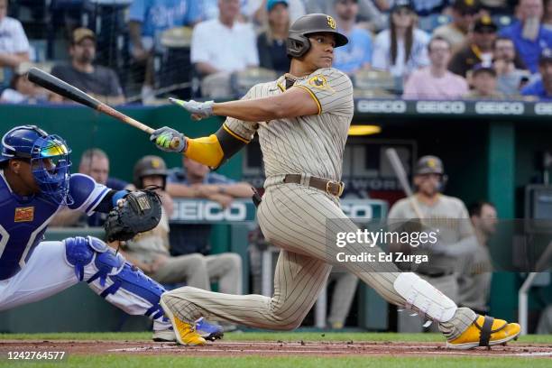 Juan Soto of the San Diego Padres hits a single in the first inning against the Kansas City Royals at Kauffman Stadium on August 27, 2022 in Kansas...