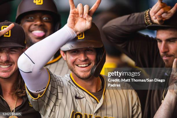 Wil Myers of the San Diego Padres celebrates in the dugout after hitting a home run in the second inning against the Kansas City Royals at Kauffman...