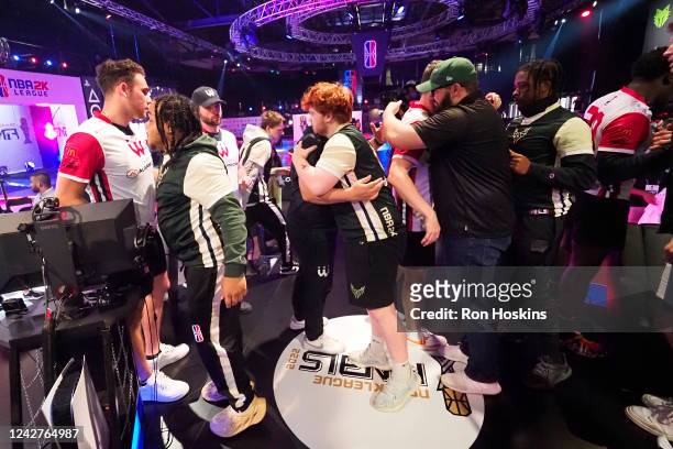 Bucks Gaming hugs Wizards District Gaming after winning the 2022 NBA 2K League 5v5 Finals on August 27, 2022 at NBA 2K League Studio in Indianapolis,...