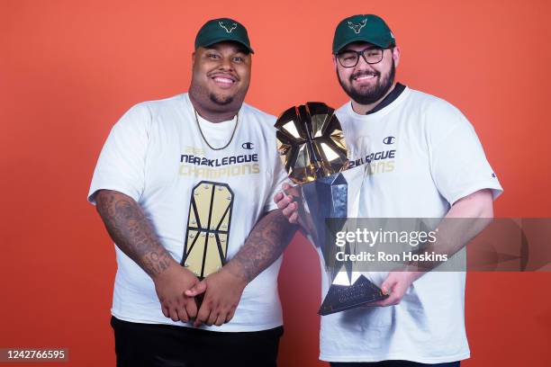 Dimez and Head Coach Lance Sessions II of Bucks Gaming pose for a photo with the NBA2K 5v5 Finals MVP trophy and finals trophy after winning the 2022...