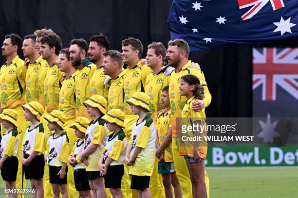 Australian captain Aaron Finch is flanked by Chloe and Billy Symonds , children of the late Australian cricketer Andrew Symonds, before the first...
