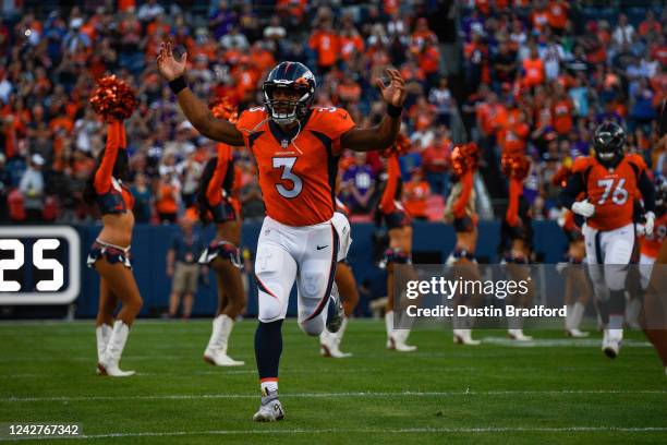 Quarterback Russell Wilson of the Denver Broncos runs onto the field before a preseason game against the Minnesota Vikings at Empower Field at Mile...