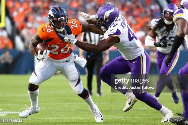 Mike Boone of the Denver Broncos runs the ball during the first half of the preseason game against the Minnesota Vikings at Empower Field At Mile...