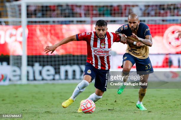 Alexis Vega of Chivas fights for the ball with Daniel Alves of Pumas during the 11th round match between Chivas and Pumas UNAM as part of the Torneo...