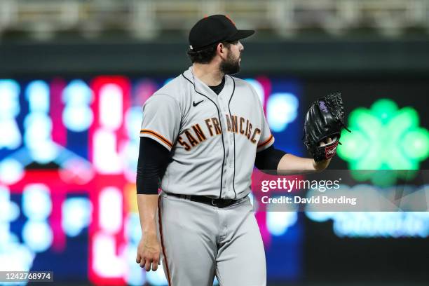 Dominic Leone of the San Francisco Giants reacts to issuing a bases loaded walk-off walk to Gilberto Celestino of the Minnesota Twins in the tenth...