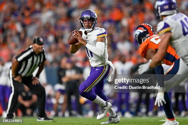 Quarterback Kellen Mond of the Minnesota Vikings looks to pass against the Denver Broncos in the second half of a preason NFL game at Empower Field...