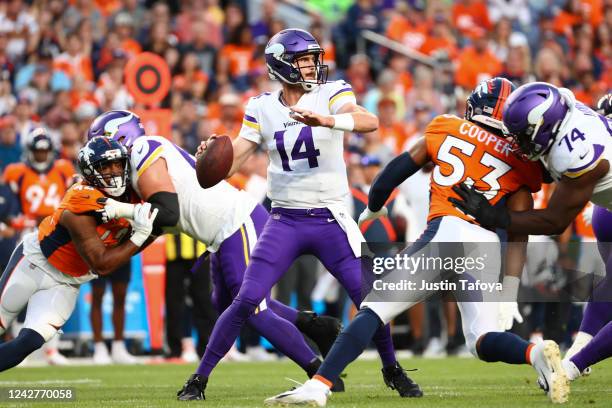 Sean Mannion of the Minnesota Vikings looks to pass during the first half of a preseason game against the Denver Broncos at Empower Field At Mile...