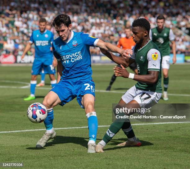 Bolton Wanderers' Kieran Lee battles with Plymouth Argyle's Bali Mumba during the Sky Bet League One between Plymouth Argyle and Bolton Wanderers at...