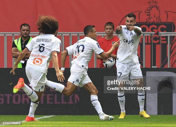 Marseille's Chilean forward Alexis Sanchez celebrates with teammates after scoring a goal during the French L1 football match between OGC Nice and...