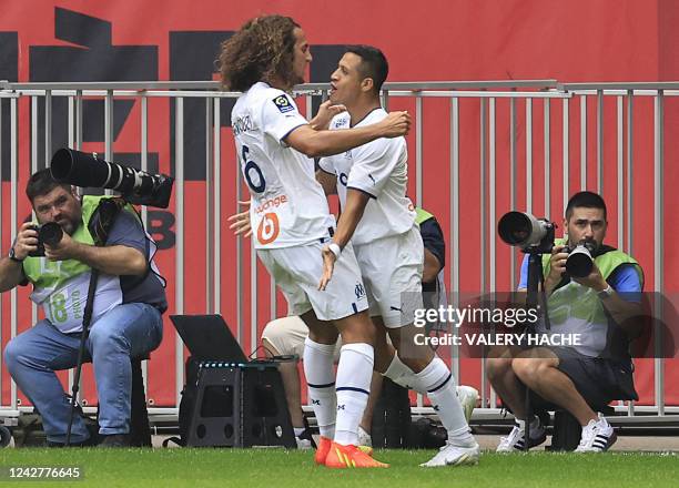 Marseille's Chilean forward Alexis Sanchez celebrates with teammates after scoring a goal during the French L1 football match between OGC Nice and...