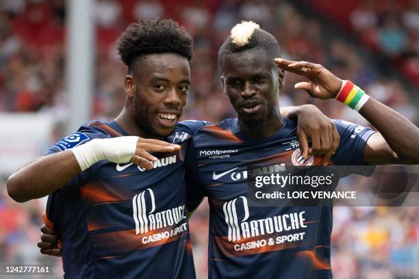 Montpellier's French forward Elye Wahi celebrates wirth Montpellier's French defender Mamadou Sakho after scoring his team's fifth goal during the...