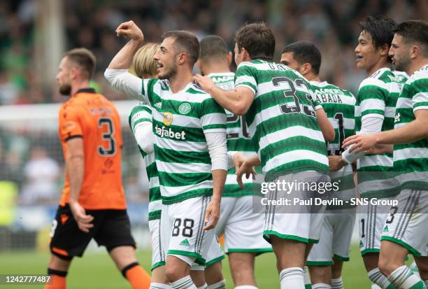 Josip Juranovic celebrates making it 6-0 during a cinch Premiership match between Dundee United and Celtic at Tannadice, on August 28 in Dundee,...