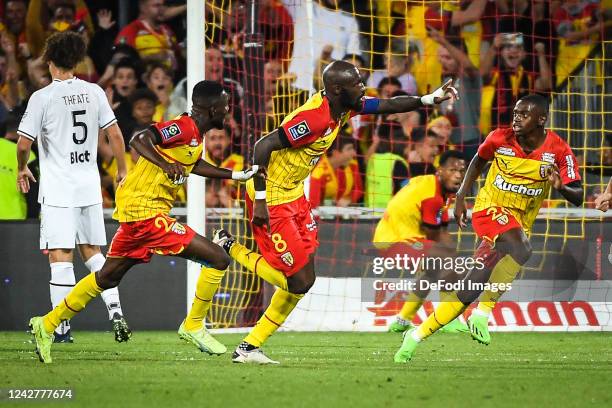 Seko Fofana of RC Lens celebrates after scoring his team's first goal with teammates during the Ligue 1 match between RC Lens and Stade Rennes at...