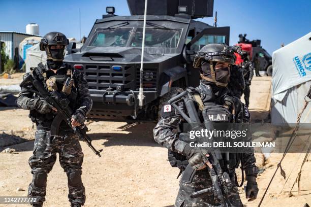 Members of the Syrian Kurdish Asayish security forces inspect tents at the Kurdish-run al-Hol camp, which holds relatives of suspected Islamic State...