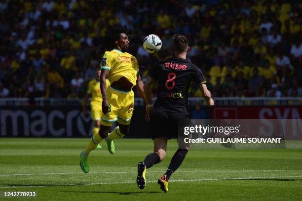 Nantes' French midfielder Samuel Moutoussamy fights for the ball with Toulouse' Dutch midfielder Branco Van Den Boomen , during the French L1...