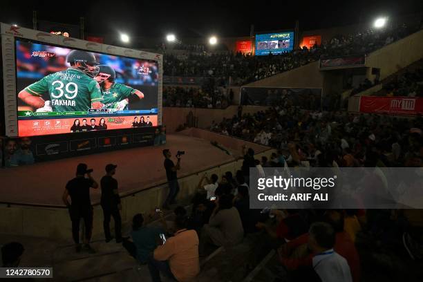 Cricket fans watch the live telecast of the Asia Cup Twenty20 international cricket match between India and Pakistan in Dubai, on big screens in...