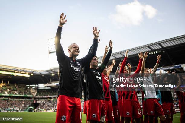 Sebastian Rode of Frankfurt and his team mates celebrate their win win their fans after the Bundesliga match between SV Werder Bremen and Eintracht...