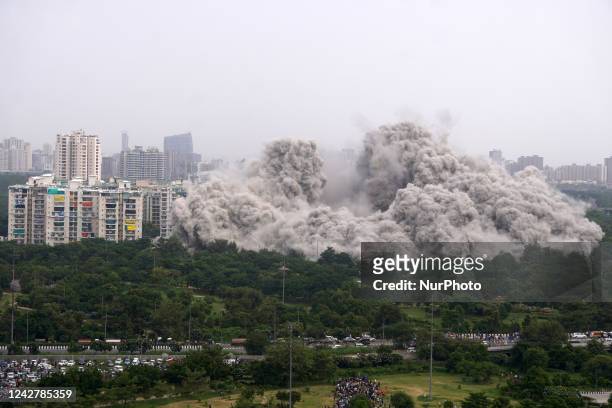 The Supertech Twin Towers collapse making a cloud of dust following a controlled demolition by explosion after the Supreme Court found them in...