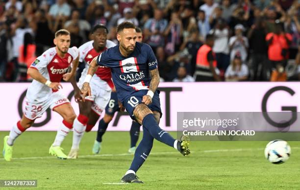 Paris Saint-Germain's Brazilian forward Neymar shoot and scores a penalty kick during the French L1 football match between Paris-Saint Germain and AS...