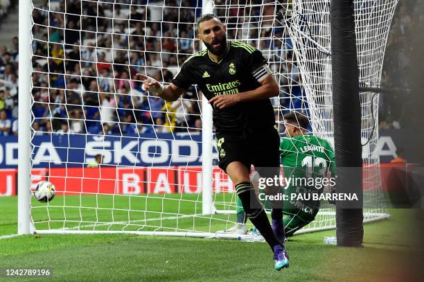 Real Madrid's French forward Karim Benzema celebrates scoring his team's second goal during the Spanish League football match between RCD Espanyol...