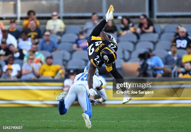 Najee Harris of the Pittsburgh Steelers attempts to hurdle over Saivion Smith of the Detroit Lions during the second quarter at Acrisure Stadium on...