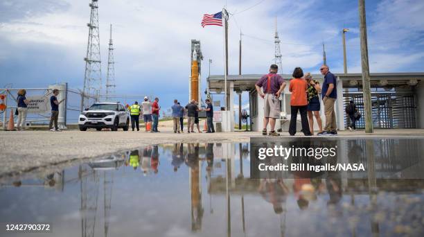 In this handout image provided by NASA, NASA's Space Launch System rocket with the Orion spacecraft aboard is seen atop a mobile launcher at Launch...