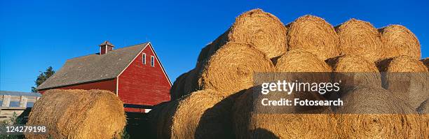 red barn and haystacks - idaho falls stock-fotos und bilder