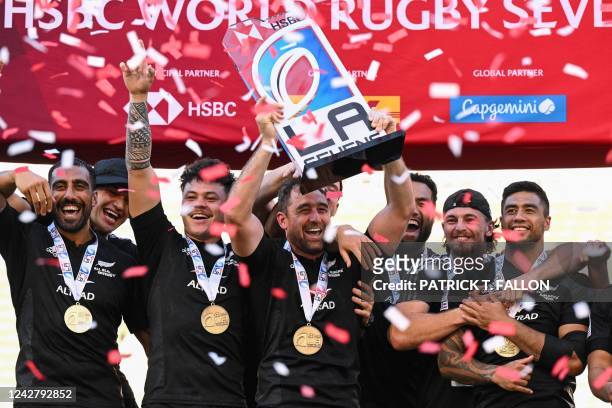 New Zealand's All Blacks Sevens team celebrates their win after the rugby union final match between New Zealand and Fiji on the second day of the Los...
