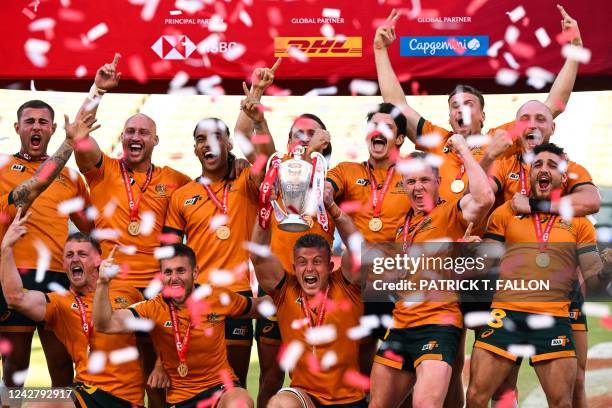 Australia's rugby 7s team celebrates winning the World Rugby HSBC Sevens Series Championship at Dignity Health Sports Park in Carson, California on...