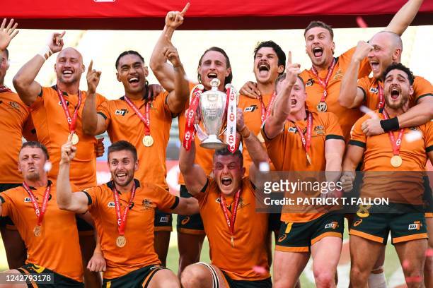 Australia's rugby 7s team celebrates winning the World Rugby HSBC Sevens Series Championship at Dignity Health Sports Park in Carson, California on...