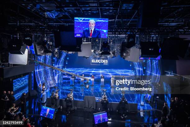 Luiz Inacio Lula da Silva, Brazil's former president, is on the screen during the first televised presidential debate in Sao Paulo, Brazil, on...