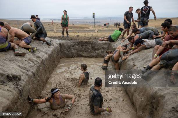 Competitors take part in "Tough Mudder" in Sonoma, California, United States on August 28, 2022. Tough Mudder is an endurance event series in which...