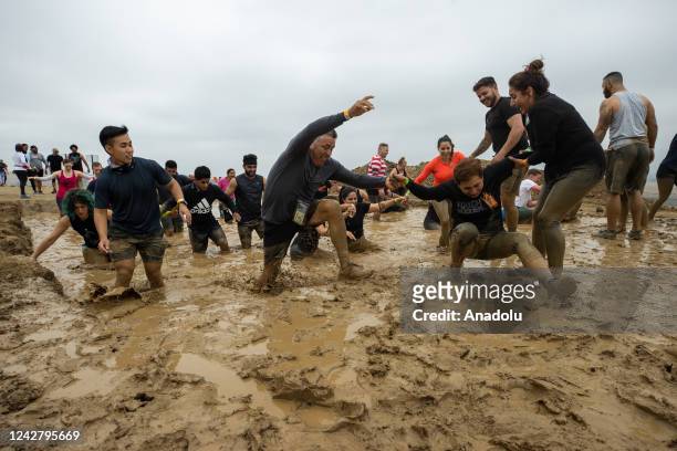 Competitors take part in "Tough Mudder" in Sonoma, California, United States on August 28, 2022. Tough Mudder is an endurance event series in which...