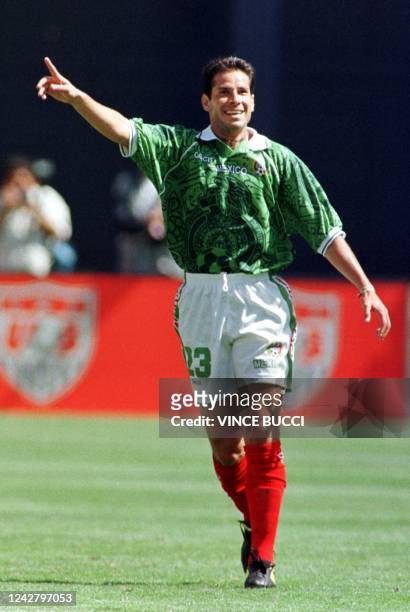 Jose Manuel Abundis of Mexico raises his hand after scoring a goal against Team USA during their Nike US Cup soccer match 13 March 1999 in San Diego,...