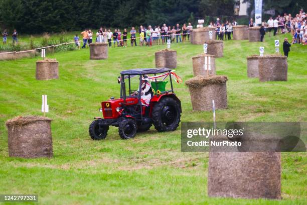 Participant attends a tractors race called 'Traktoryja' organized as part of traditional Dozhinki harvest festival. Gieraltowice, Wadowice County in...