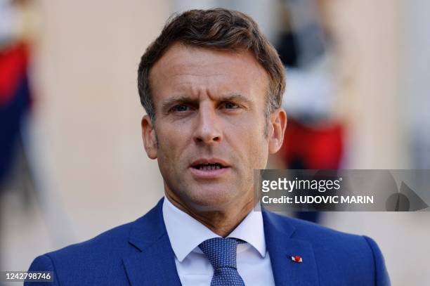 French President Emmanuel Macron gives a press statement with the Polish prime minister prior to their meeting at the Elysee Palace in Paris on...