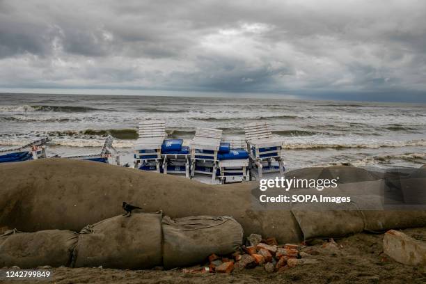 Barricades have been erected at the Coxs Bazar sea beach as the water level rises. Water erosion has damaged the Laboni and Sugondha points in Cox's...