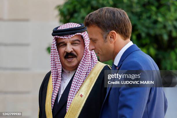 French President Emmanuel Macron welcomes Bahrain's King Hamad bin Isa al-Khalifa prior to their meeting at the Elysee Palace in Paris on August 29,...