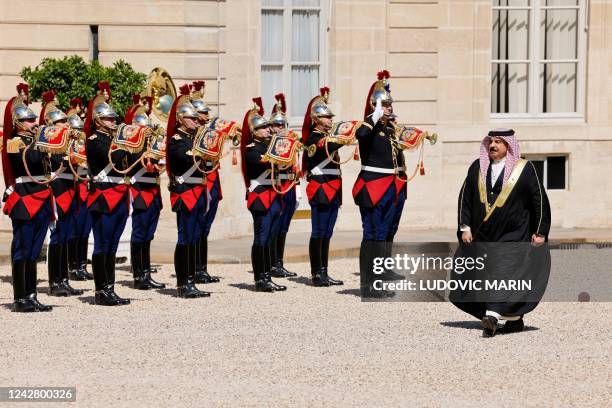 Bahrain's King Hamad bin Isa al-Khalifa reviews a guard of honour as he arrives for a meeting with the French president at the Elysee Palace in Paris...