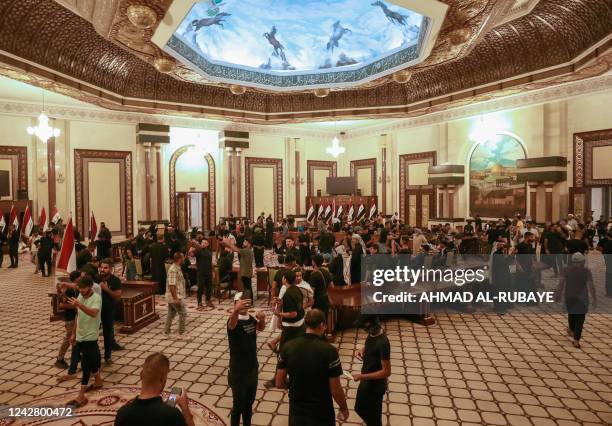 Supporters of Iraqi Shiite cleric Moqtada Sadr gather inside the Government Headquarters in the capital Baghdad's Green Zone, on August 29, 2022. -...