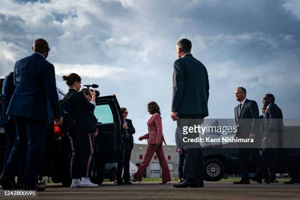 Vice President Kamala Harris walks to her motorcade vehicle after she and Second Gentleman Doug Emhoff disembarked from Air Force 2 at the Shuttle...