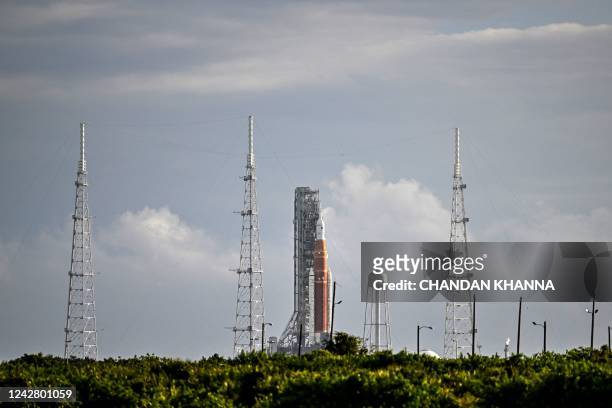 The Artemis I unmanned lunar rocket sits on the launch pad at the Kennedy Space Center in Cape Canaveral, Florida, on August 29, 2022. - NASA called...