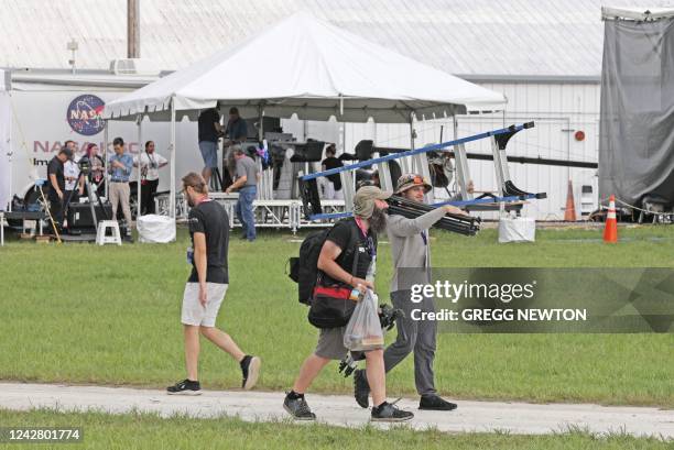 Members of the media pack up their equipment after the launch of the Artemis I unmanned lunar rocket was postponed, at the Kennedy Space Center in...