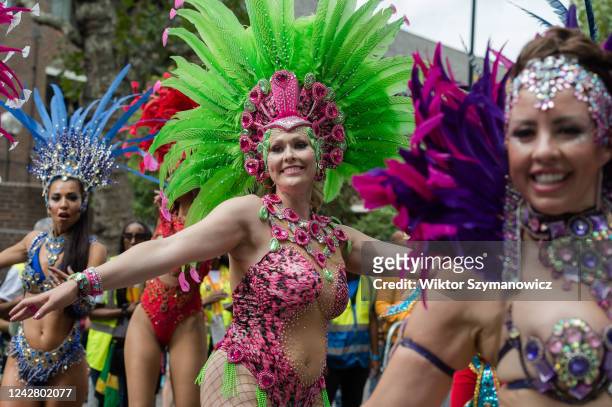 Samba performers in colourful costumes dance during the grand finale of the Notting Hill Carnival on August 29, 2022 in London, England. Two million...