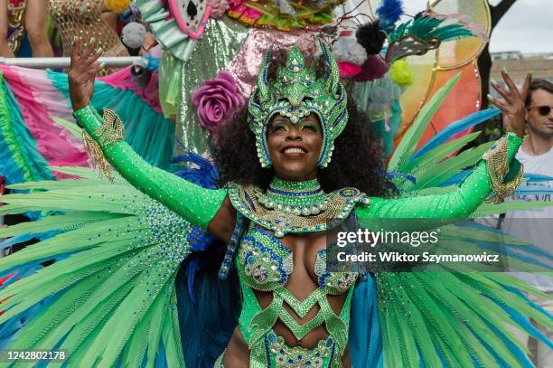 Samba performer in a colourful costume dances during the grand finale of the Notting Hill Carnival on August 29, 2022 in London, England. Two million...