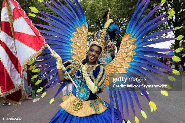 Samba performer in a colourful costume dances during the grand finale of the Notting Hill Carnival on August 29, 2022 in London, England. Two million...